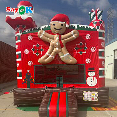 Thiết kế 3D miễn phí 0.55mm PVC Tarpaulin Giáng sinh bơm nổi Tháp nhảy Gingerbread Bounce House với Blower