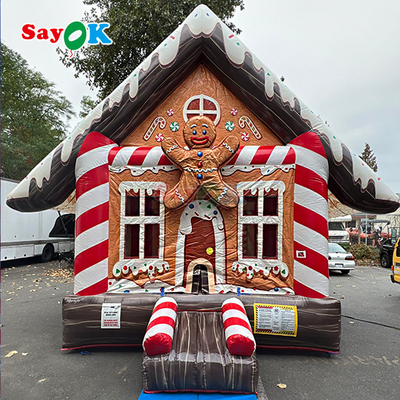 Thiết kế 3D miễn phí 0.55mm PVC Tarpaulin Giáng sinh bơm nổi Tháp nhảy Gingerbread Bounce House với Blower